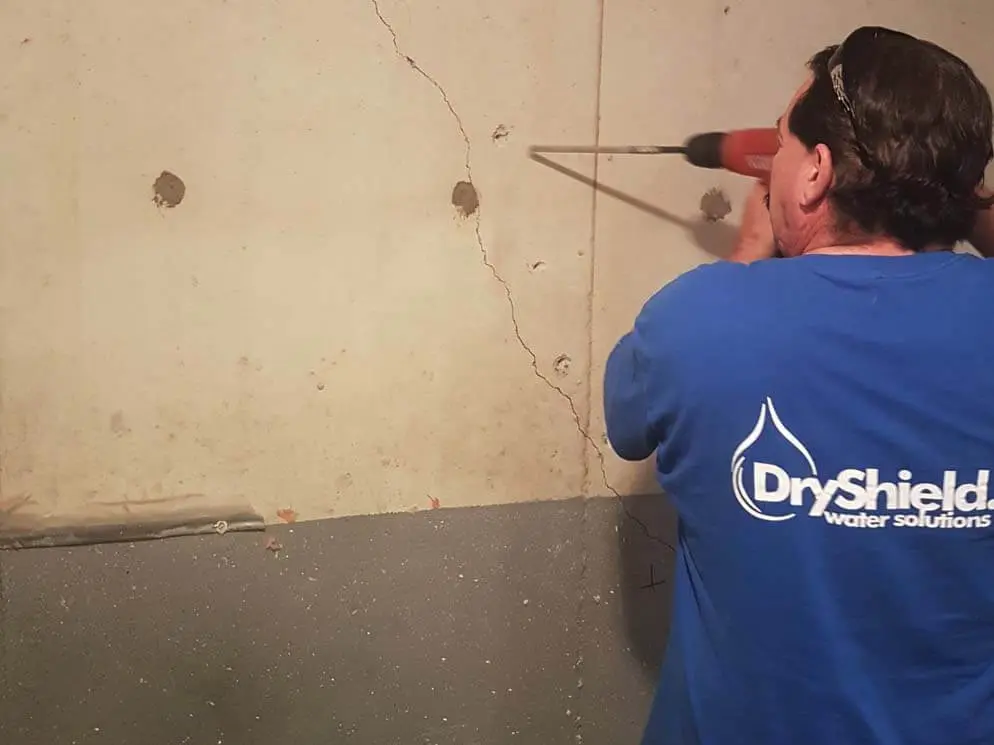 Dryshield technician performing foundation crack injection on a Windsor area residential foundation
